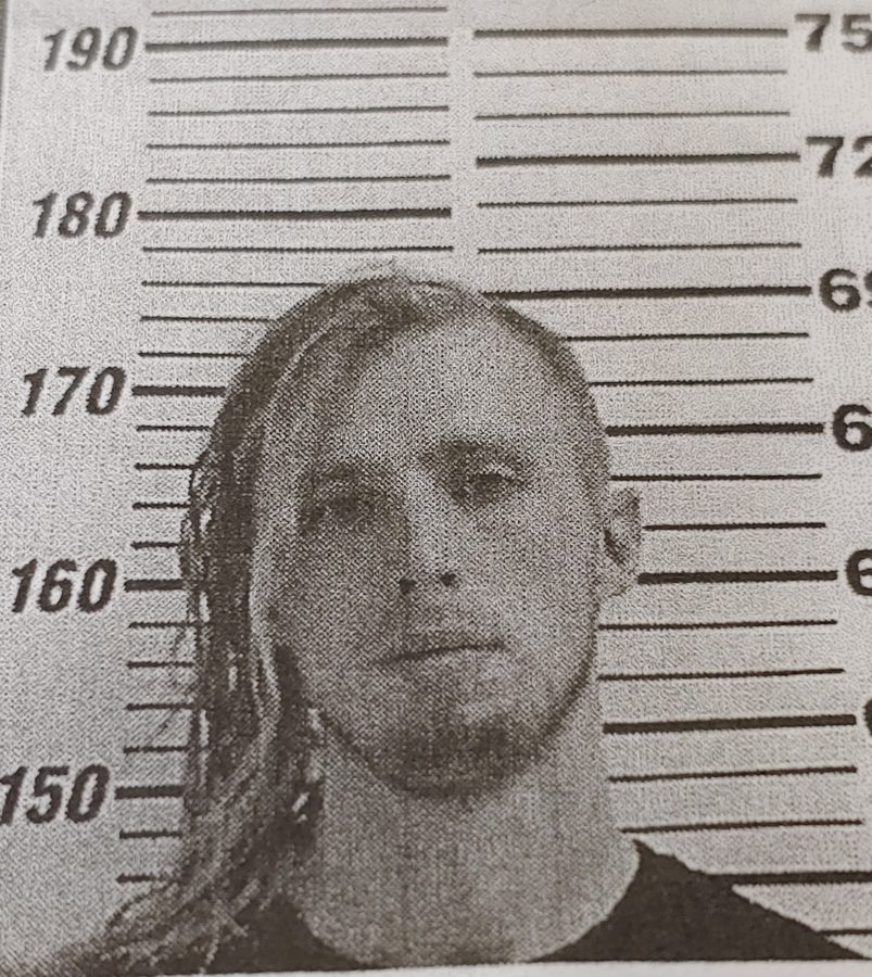 Austin's mugshot from an earlier period of his life